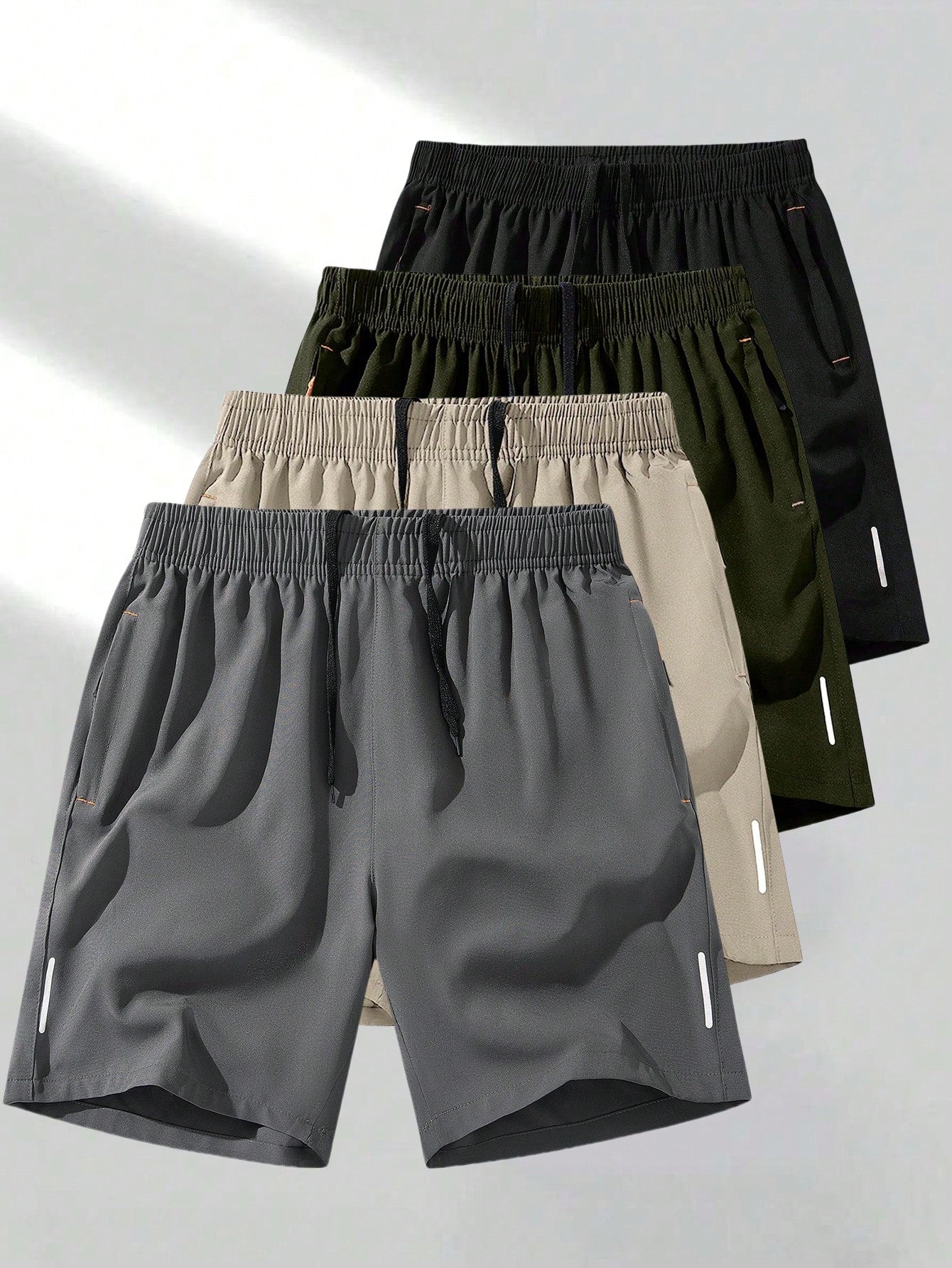 Men’s Breathable Sports Shorts Lightweight Athletic for Training & Running in a variety of colors including dark grey, beige, green, and black.