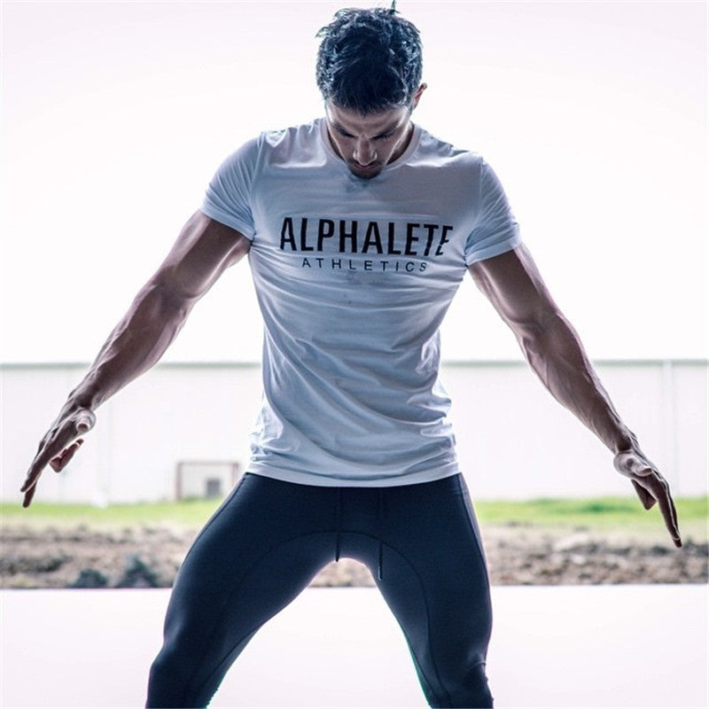 Fitness T-Shirt - Stylish Cotton Wear for Every Athlete worn by a fit model demonstrating athletic style.